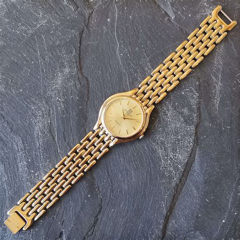 Vintage Givenchy Round Quartz Gold Watch 